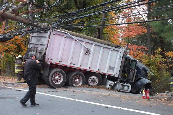 Dump Truck Crashes Into Utility Pole In Hawthorne