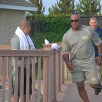 <p>Master Sergeant Ishmoile Mohammed running in a training exercise at Wading River Beach in 2014.</p>