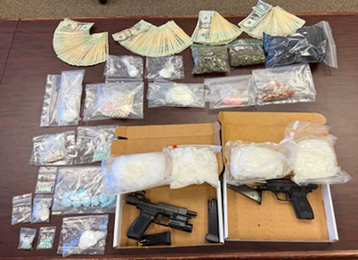 The seized drugs and weapons in Frederick.