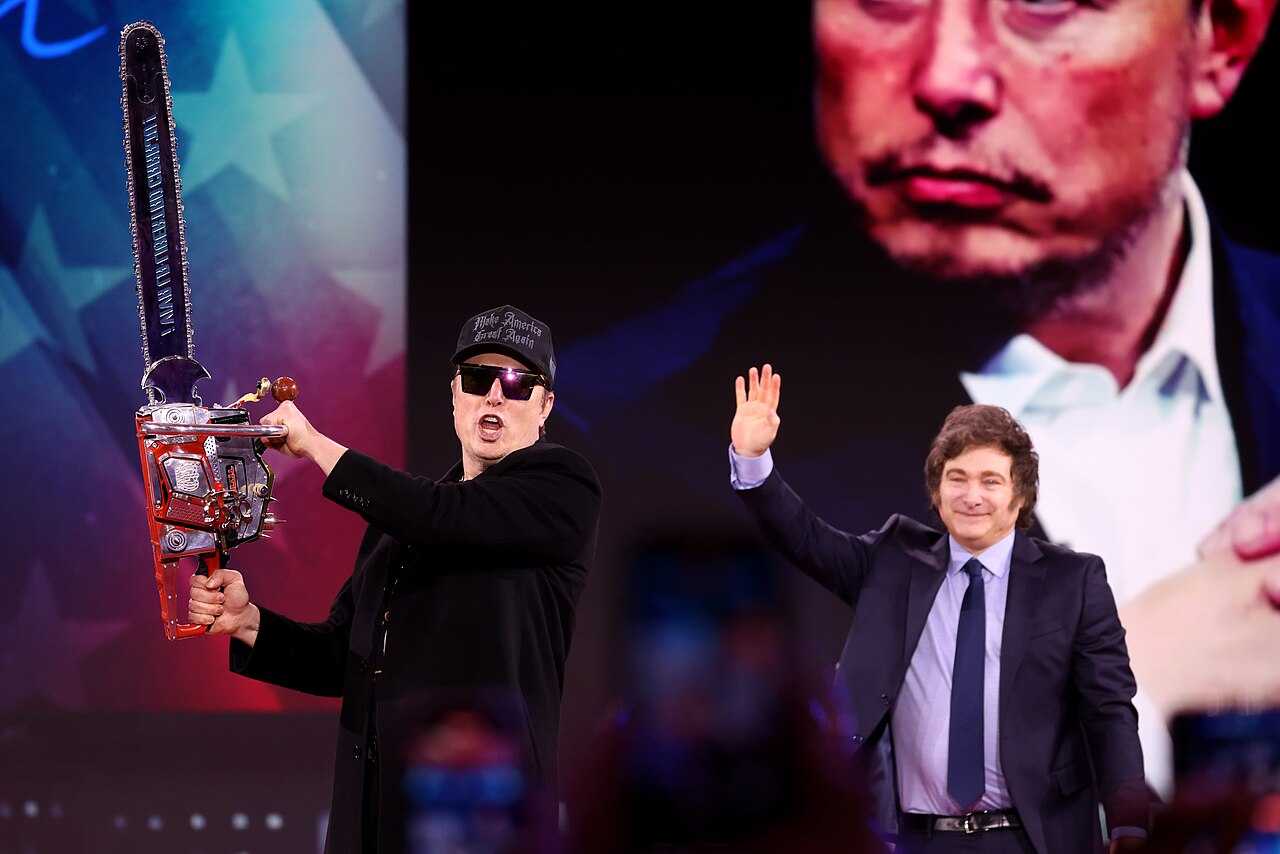 Tesla CEO Elon Musk holding up a chainsaw while standing next to Argentina's President Javier Milei at the Conservative Political Action Conference (CPAC) on February 20, 2025. Tesla CEO Elon Musk holding up a chainsaw while standing next to Argentina's President Javier Milei at the Conservative Political Action Conference (CPAC) on February 20, 2025.
