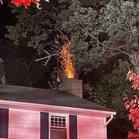 <p>Flames shooting out a chimney.</p>