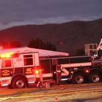 <p>A fire engine arriving at the scene of the house fire on Corner Road in Montgomery Township.</p>