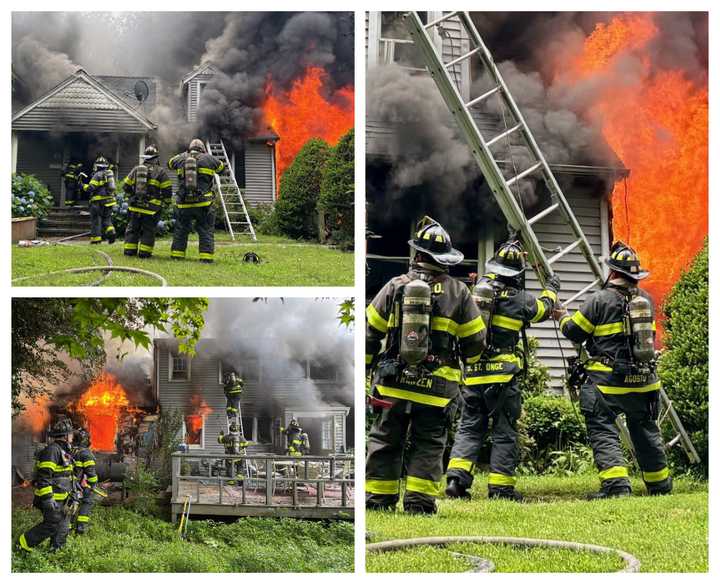 Norwalk firefighters battle a blaze at a home at 4 Tryon St. Friday afternoon, June 27.&nbsp;