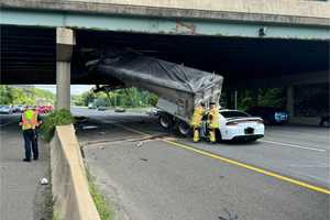 Wild Capital Beltway Crash Involves Trailer Wedged In Overpass, Sedan Crash (PHOTOS)