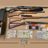 <p>The guns and other items seized during the bust.</p>