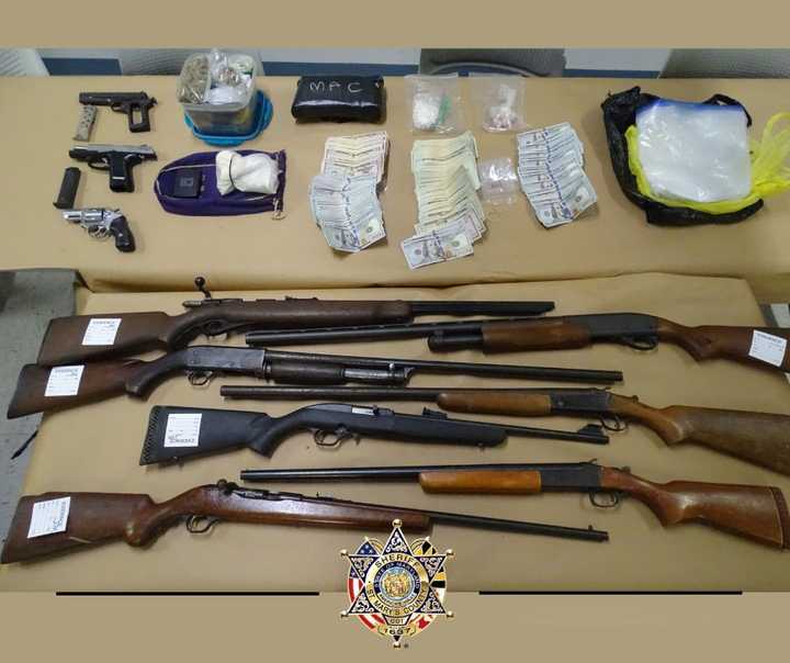 The guns and other items seized during the bust in St. Mary's County.