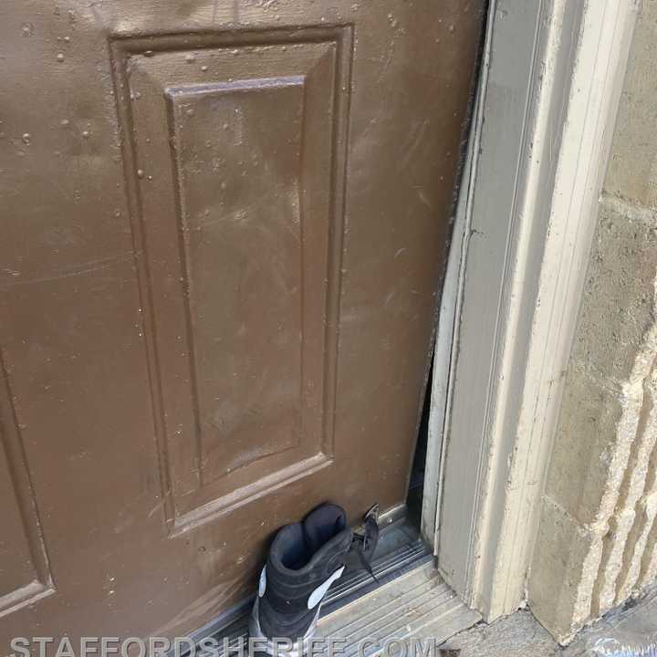 One of the suspects was charged after his shoe became lodged in the door