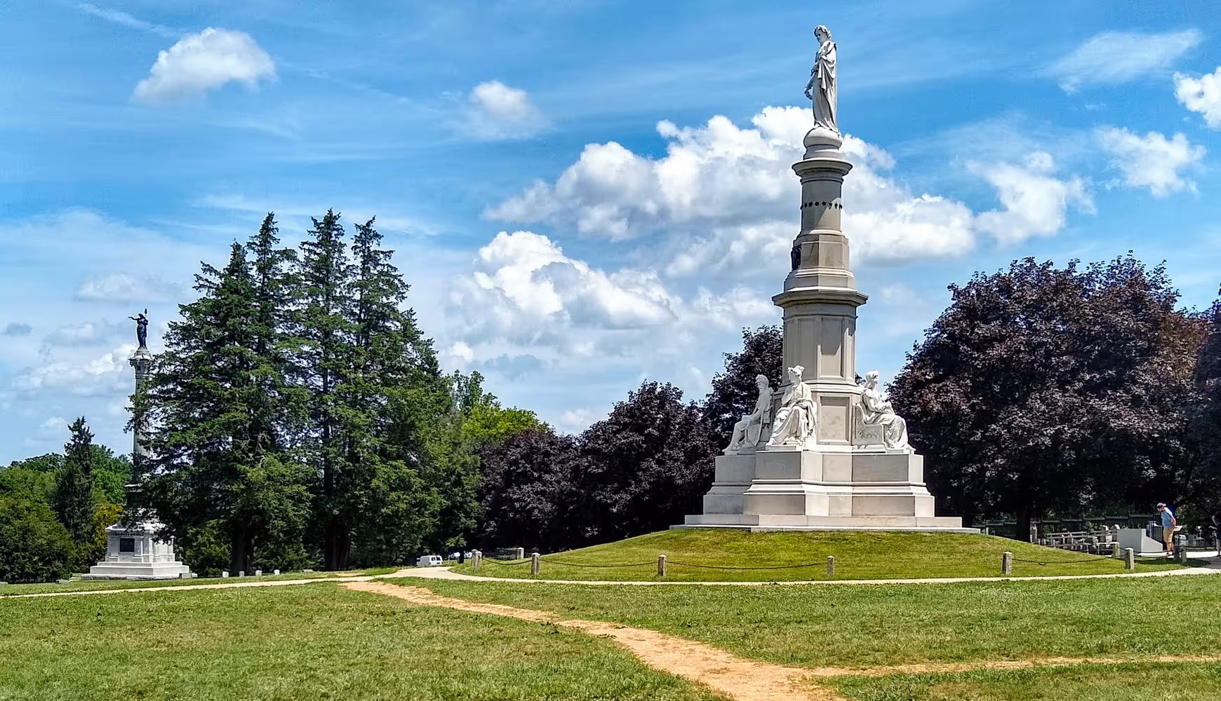 The Soldier's National Monument and New York State monument at the Gettysburg National Cemetery in Gettysburg, PA.
 
The Soldier's National Monument and New York State monument at the Gettysburg National Cemetery in Gettysburg, PA.