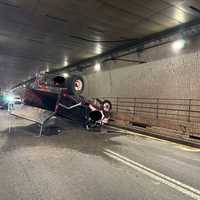 Overturned Dump Truck Clogs Fort McHenry Tunnel, Spills Gravel On I-95