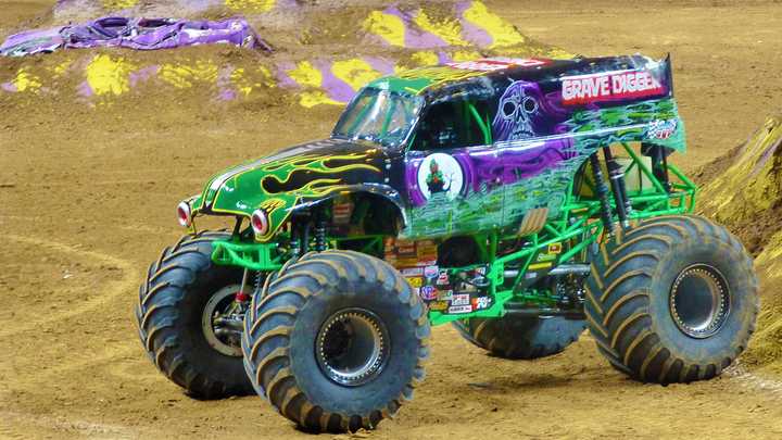 Grave Digger roars into action, thrilling fans with its signature black-and-green design and legendary freestyle stunts.
  
