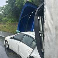 <p>The overturned tractor-trailer.
  
</p>