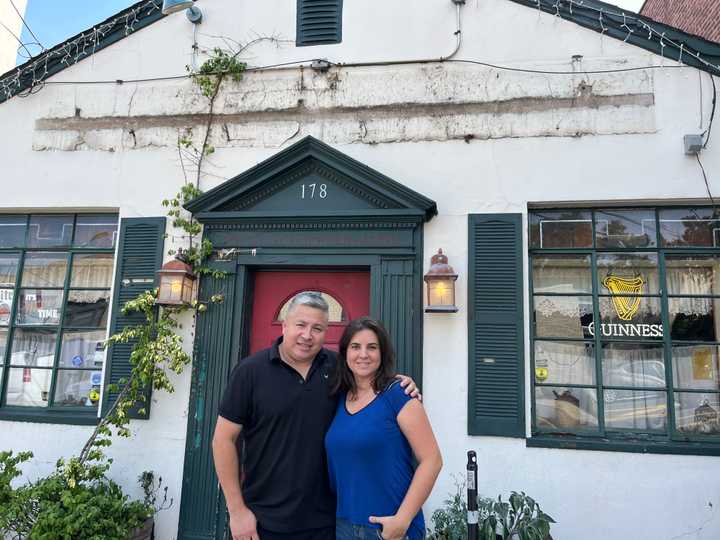 Jorge Mora and Annabella "Sol" Cavagliato in front of The Cottage Bar, which they're taking over and renaming Pub 178.