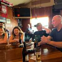 <p>Fergus, far right, is visiting from Ireland. He drank at the bar at 178 Cedar Lane in the early 1990s, before it became The Cottage Bar.&nbsp;</p>