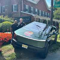 <p>Fabio Antonio Arbelaez and Ryan McDermott with a Tesla Cybertruck outside of The Columbia Inn.&nbsp; &nbsp; &nbsp;
  
</p>