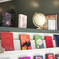 <p>A book shelf at Book Bar.&nbsp;</p>