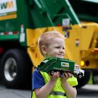 <p>Alan shows off his model WM truck next to the real thing.&nbsp;</p>