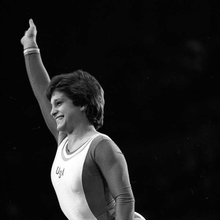 Gymnast Mary Lou Retton performing on the beam during Olympic Vidal Sassoon Looking Good Tour in Los Angeles on February 4, 1985.