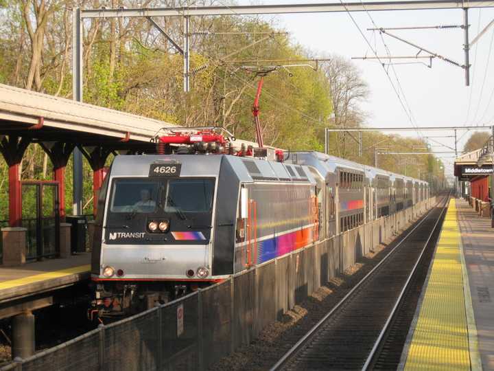 A New Jersey Transit train for the North Jersey Coast Line pulls into the station in Middletown, NJ.