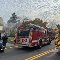 Norwalk Firefighters Smash Through Wall To Save Person Trapped In Burning Car Inside Garage