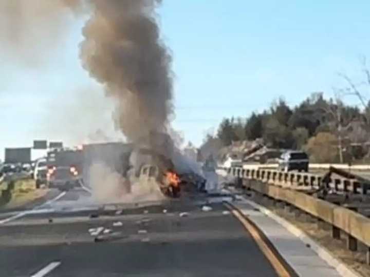 A truck smolders after it caught on fire Tuesday afternoon, Nov. 19, following a three-car crash on the Merritt Parkway.&nbsp;