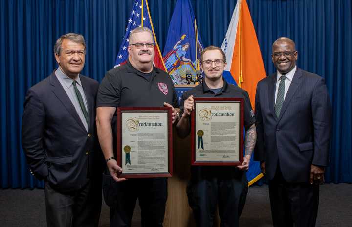 Joseph Abreau and Paul Mullin of the Ossining Volunteer Ambulance Corps were honored by Westchester County Executive George Latimer and Emergency Services Commissioner Richard Wishnie for saving a woman's life in September.      