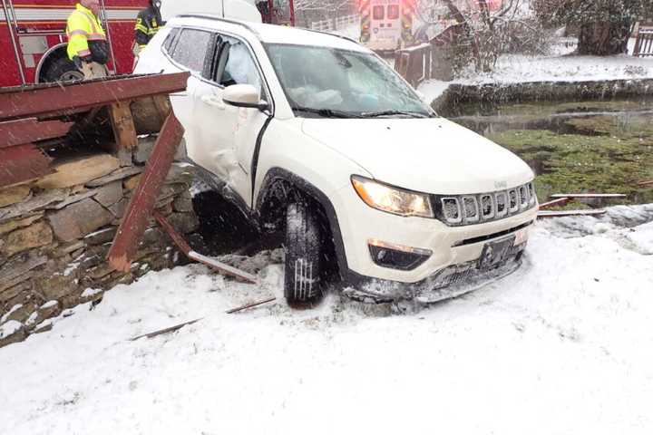 Jeep Crashes Through Central PA Fence, Into Stone Wall In Upper Allen, Injuring Woman