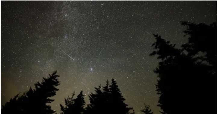 A meteor streaks across the sky during the annual Perseid meteor shower Wednesday, Aug. 11, 2021, in Spruce Knob, West Virginia.