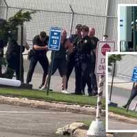 <p>Officers arrest Daniel MacTaggart outside Teterboro Airport.</p>