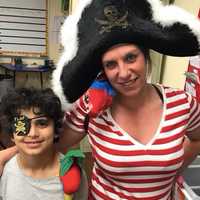 <p>Jahnan with one of his favorite teachers, AnnMarie Grieco. The two participated in the robotic challenge together.</p>