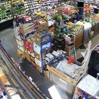 <p>An image of Garris, circled in yellow, eating produce at the grocery store.&nbsp;</p>