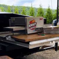 <p>The bed of the Tesla Cybertruck has a 240-volt outlet, where The Columbia Inn can plug in its Impinger oven, which works like a conveyor belt to cook the pizza in two minutes.</p>