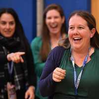 <p>Emily Litz is surprised with the Milken Award.</p>