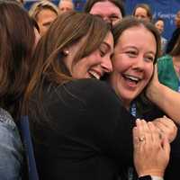 <p>Litz is rushed by a group of her colleagues in celebration after her Award ceremony.</p>