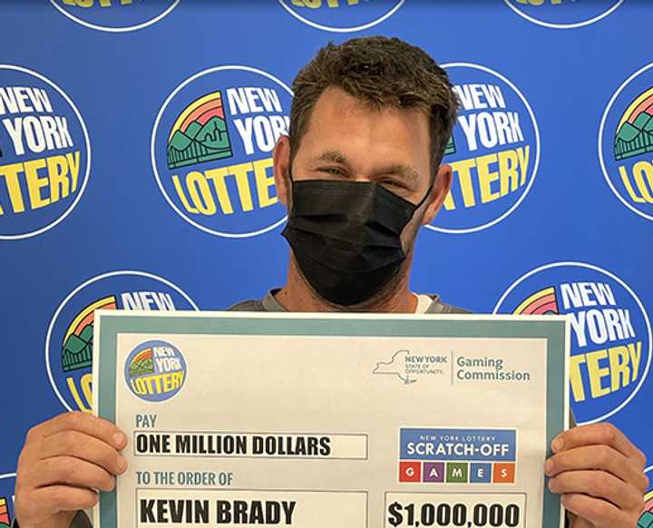 Kevin Brady and his second winning $1 million lottery ticket.