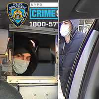 <p>New images of the suspect in the slaying show him at left in a taxi cab after fleeing the scene and at right, walking on a street clad in a down jacket and hoodie.</p>