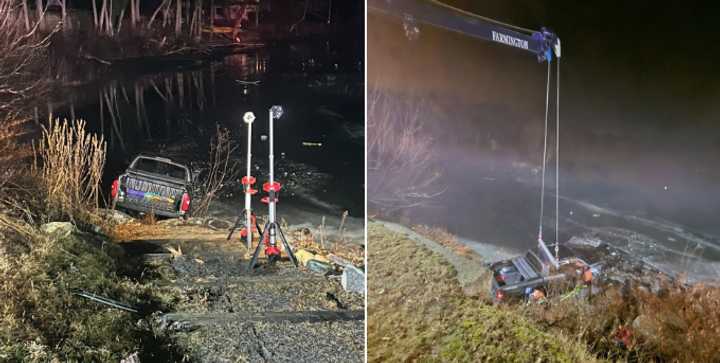 Canton emergency workers spent two hours and had to bring in a crane to lift the truck from the river.