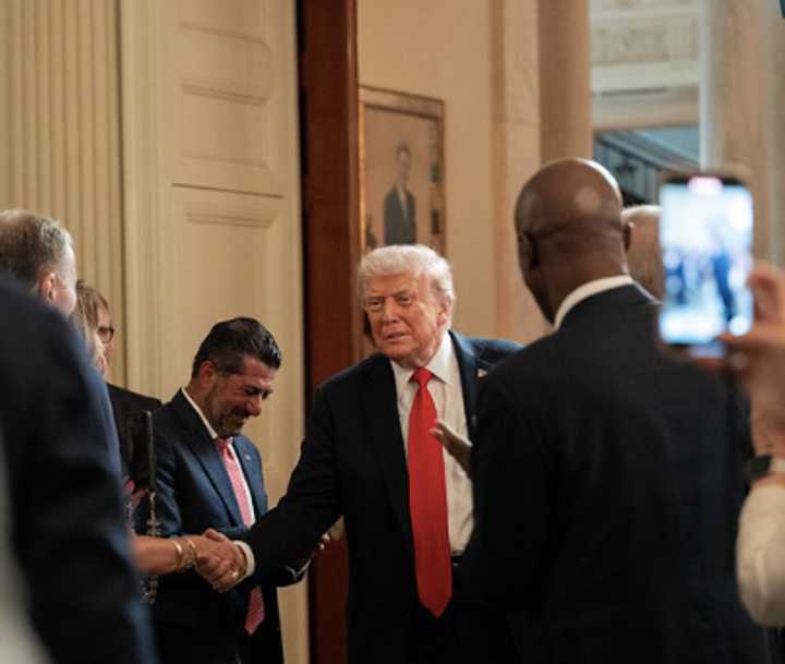 President Donald Trump shakes hands after arriving at a luncheon and briefing with the White House Faith Office on Monday, July 14, in the State Dining Room.&nbsp;