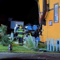 SUV Goes Airborne Into Top Floor Of Stony Point Building, Killing Driver, Responders Say