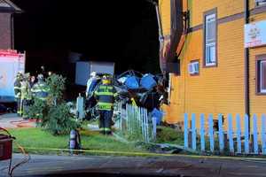 SUV Goes Airborne Into Top Floor Of NY Building, Killing Driver, Responders Say