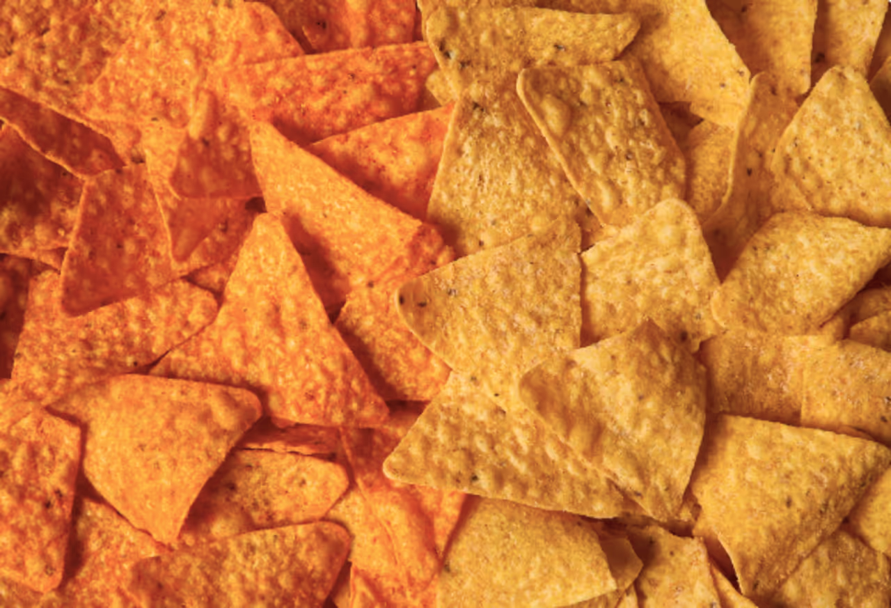 Doritos Nacho cheese, left, pictured next to new Simply NKD Nacho Cheese, which debut on Monday, Dec. 1.