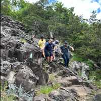 <p>The group is carrying the injured down the treacherous rocks.&nbsp;</p>