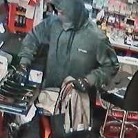 <p>The burglar emptying the cash box at the Good 2 Go convenience store, located at 500 East Main Street in Dallastown Borough.
  
</p>