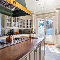 <p>The kitchen is filled with natural sunlight and state-of-the-art equipment.&nbsp;</p>