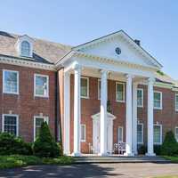 <p>The 9,300 square-foot main house features a Georgian colonial architectural design.&nbsp;</p>