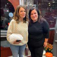 <p>Star Tina Fey poses with the owner of the Yankee Clipper Diner during her visit.&nbsp;</p>