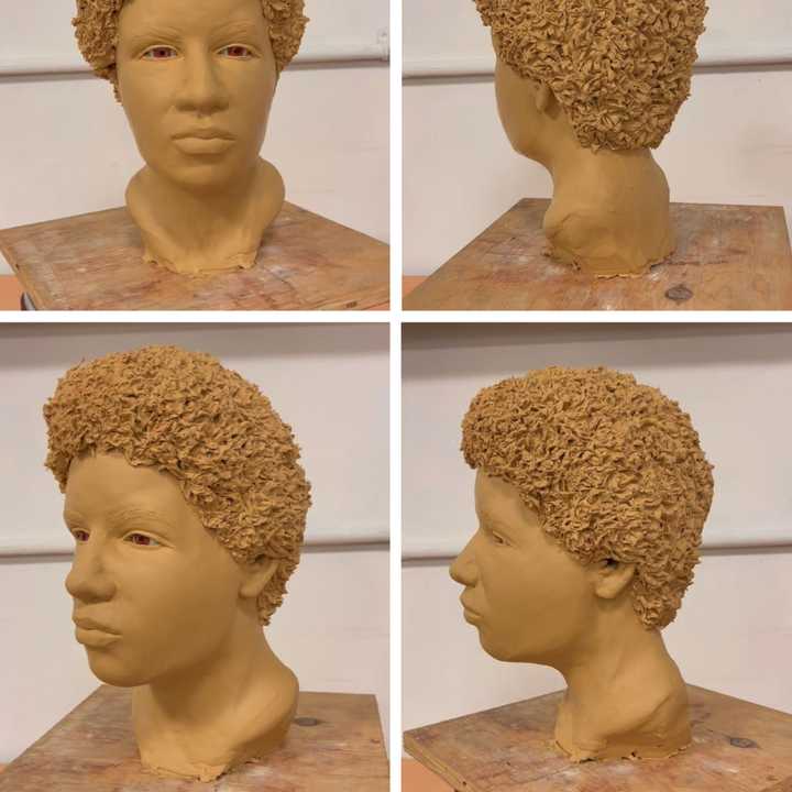 A clay reconstruction of the woman.