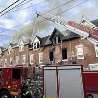 <p>Firefighters battling the blaze in 10 Norristown rowhomes. </p>