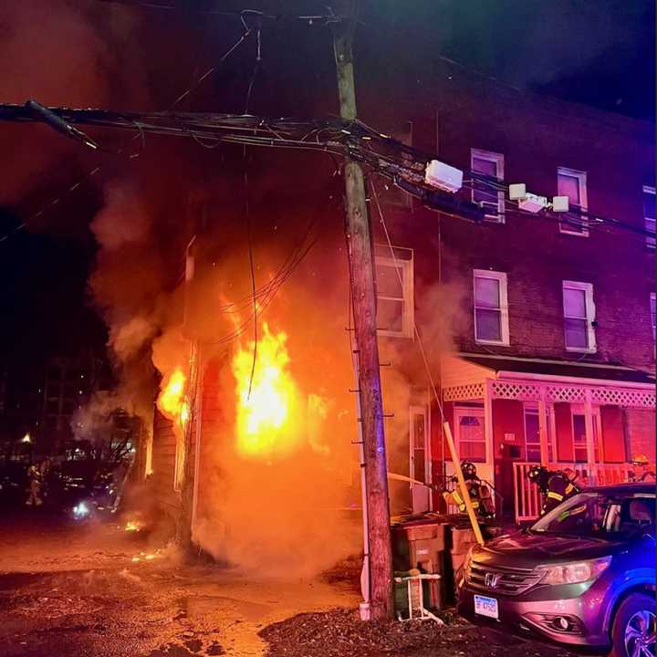 Fifty firefighters battle a two-alarm blaze at 17 Clinton Ave. in Stamford early Saturday morning, Dec. 7.