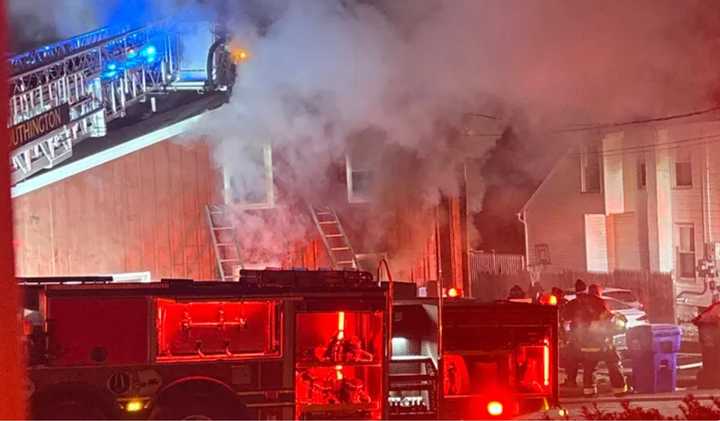 Firefighters battle an early morning blaze Thursday, Dec. 26 at 25 Howard Ave. in Southington.