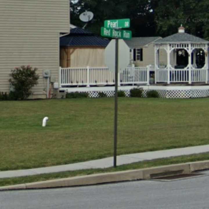 The street signs at the intersection of Red Rock Run and Pearl Drive in Penn Township where a pedestrian was struck.